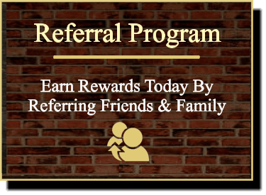 Text on a brick wall background: Referral Program - Earn Rewards Today By Referring Friends & Family with an icon of two people and an arrow.