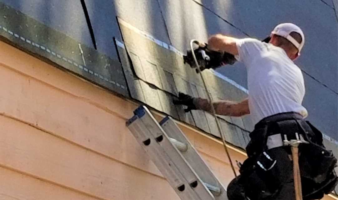 home remodel, a roofing expert installing a roof
