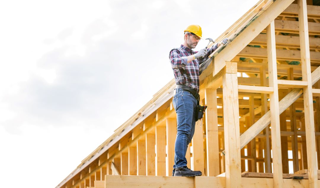 roof ventilation, a roofing professional working on a roof