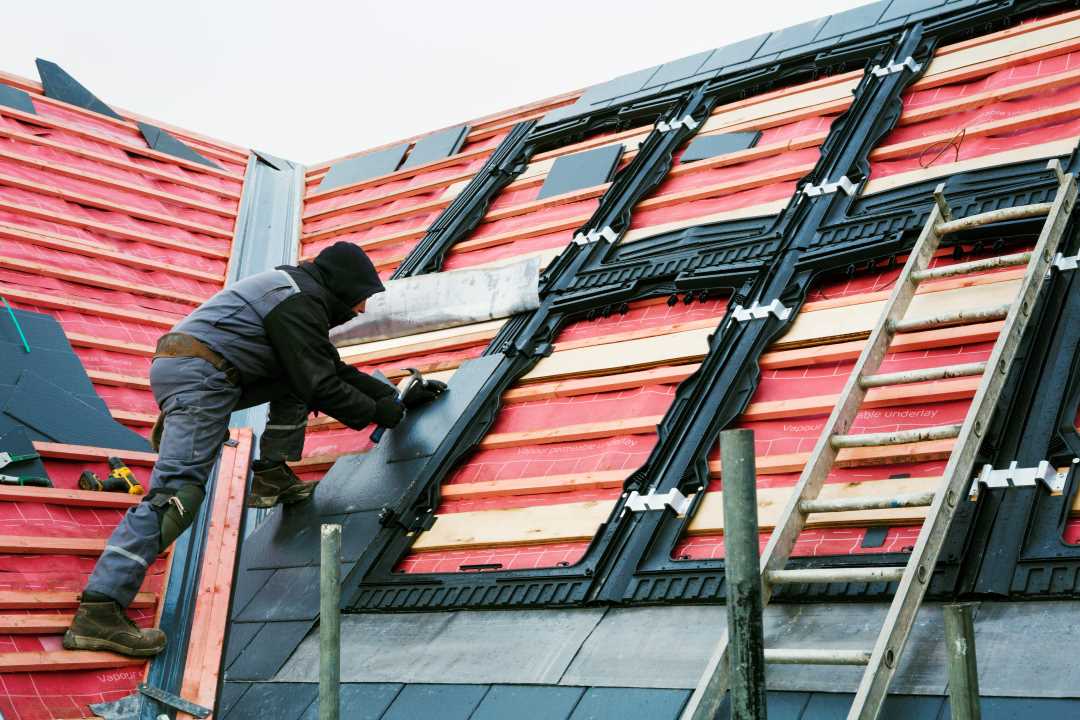 roofing services, a roofing professional fixing a roof