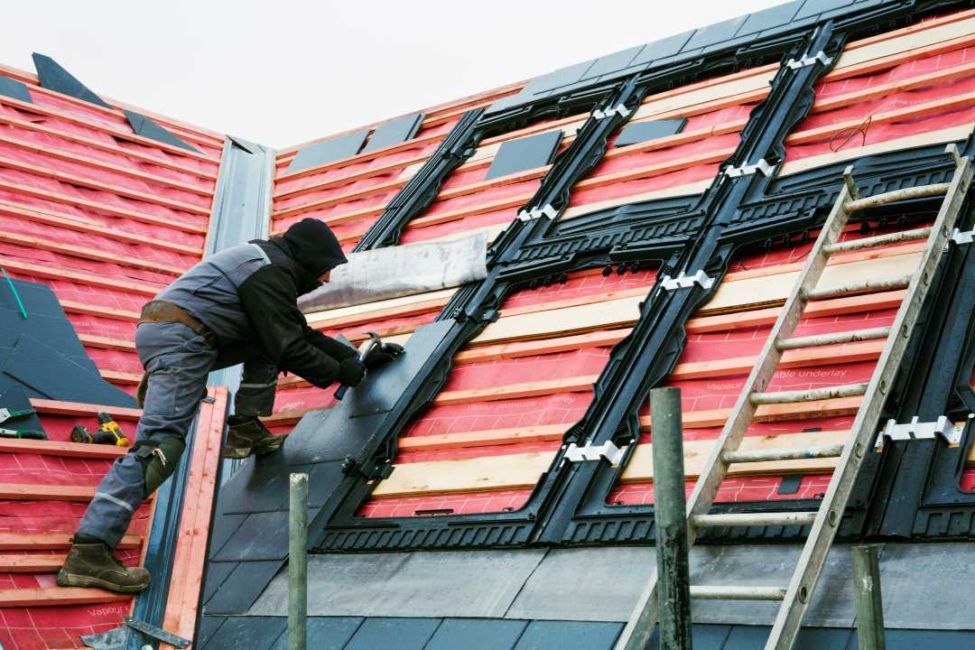 roofing services, a roofing professional fixing a roof