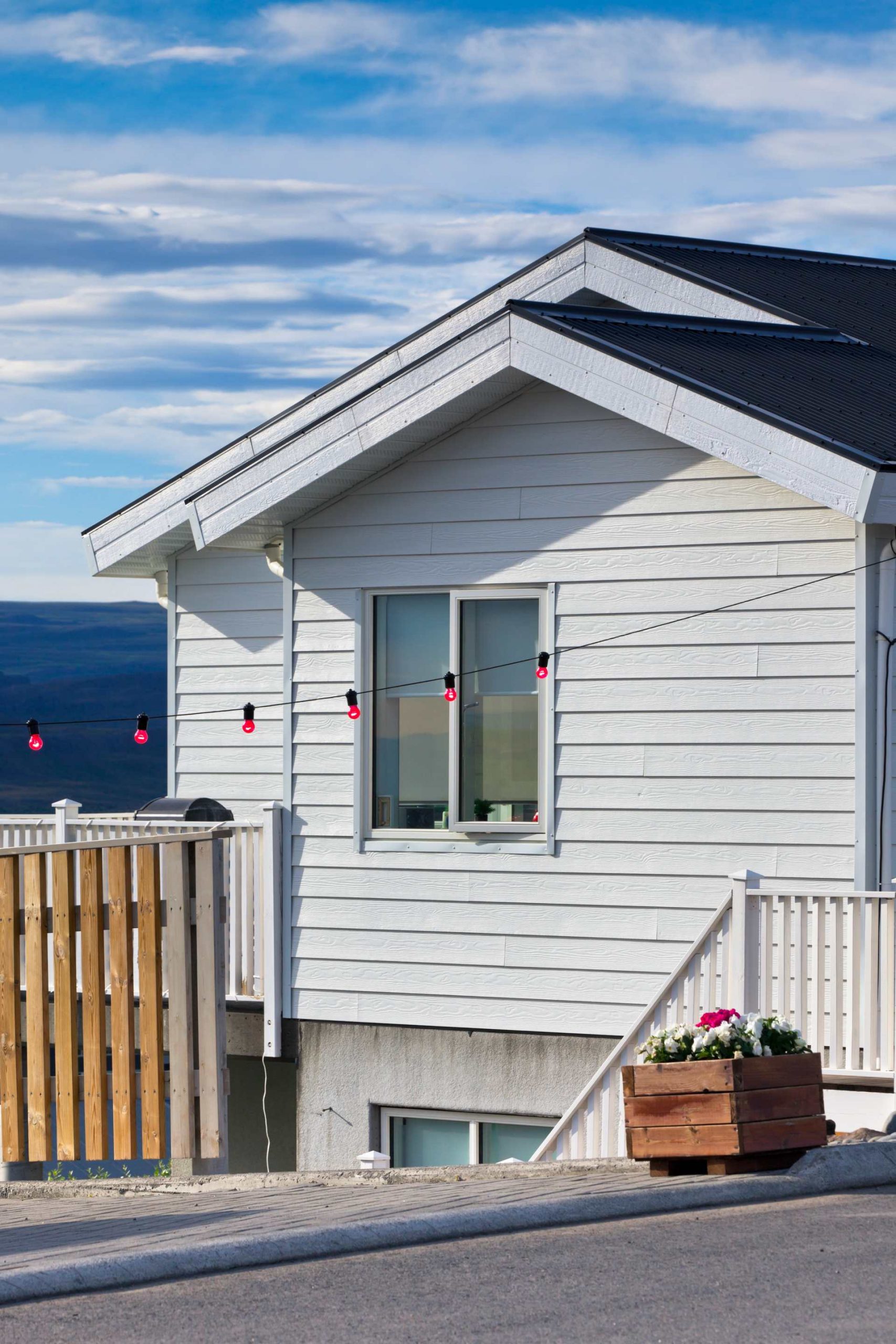 Siding trends, white siding installation that adds to the aesthetics of the house while improving functionality