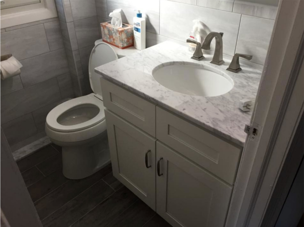 1 Stunning bathroom remodeling project in Medford, NY, showcasing modern fixtures.