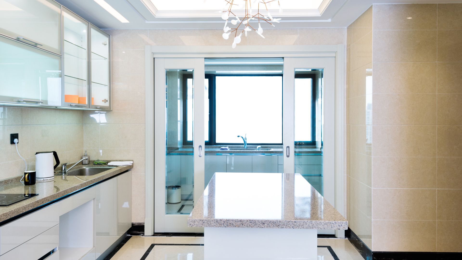 Kitchen remodeling contractor installing luxury kitchen islands and innovative lighting solutions.