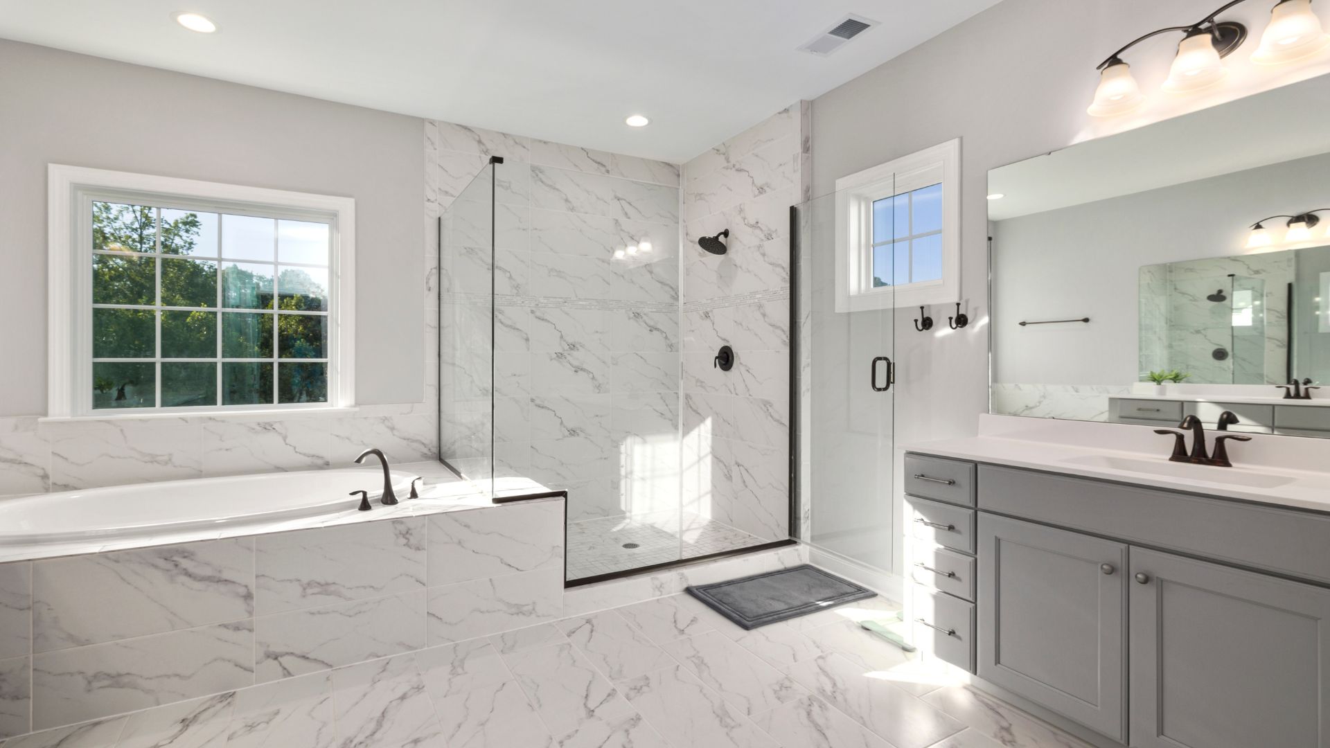 Elegant bathroom remodeling featuring custom vanities and modern tilework
