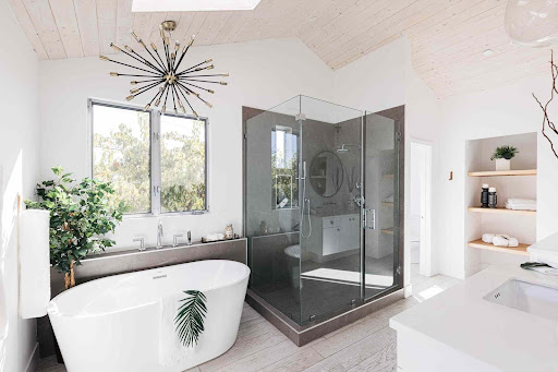 Compact bathroom with patterned floors and wood accents after a Basic Bathroom Renovation on Long Island, NY.